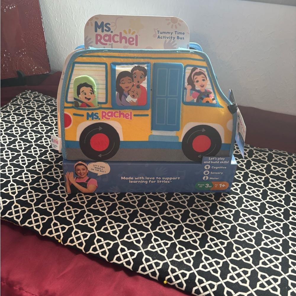 New in box. Rachel Tummy Time Activity Bus - Yellow and Blue